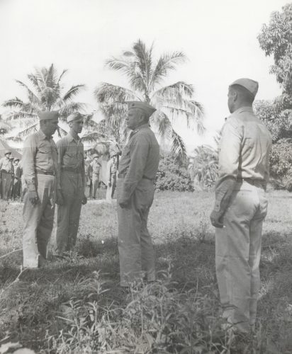 Major Gen. Roy Geiger (Center) awarding Navy Cross to Col Cooley (far Left) and Silver Star to MTSgt Dermott H. MacDonnell (2nd from the Left) 